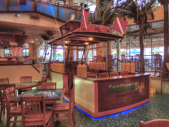 Pontoon Boat interior with wooden chairs and tables